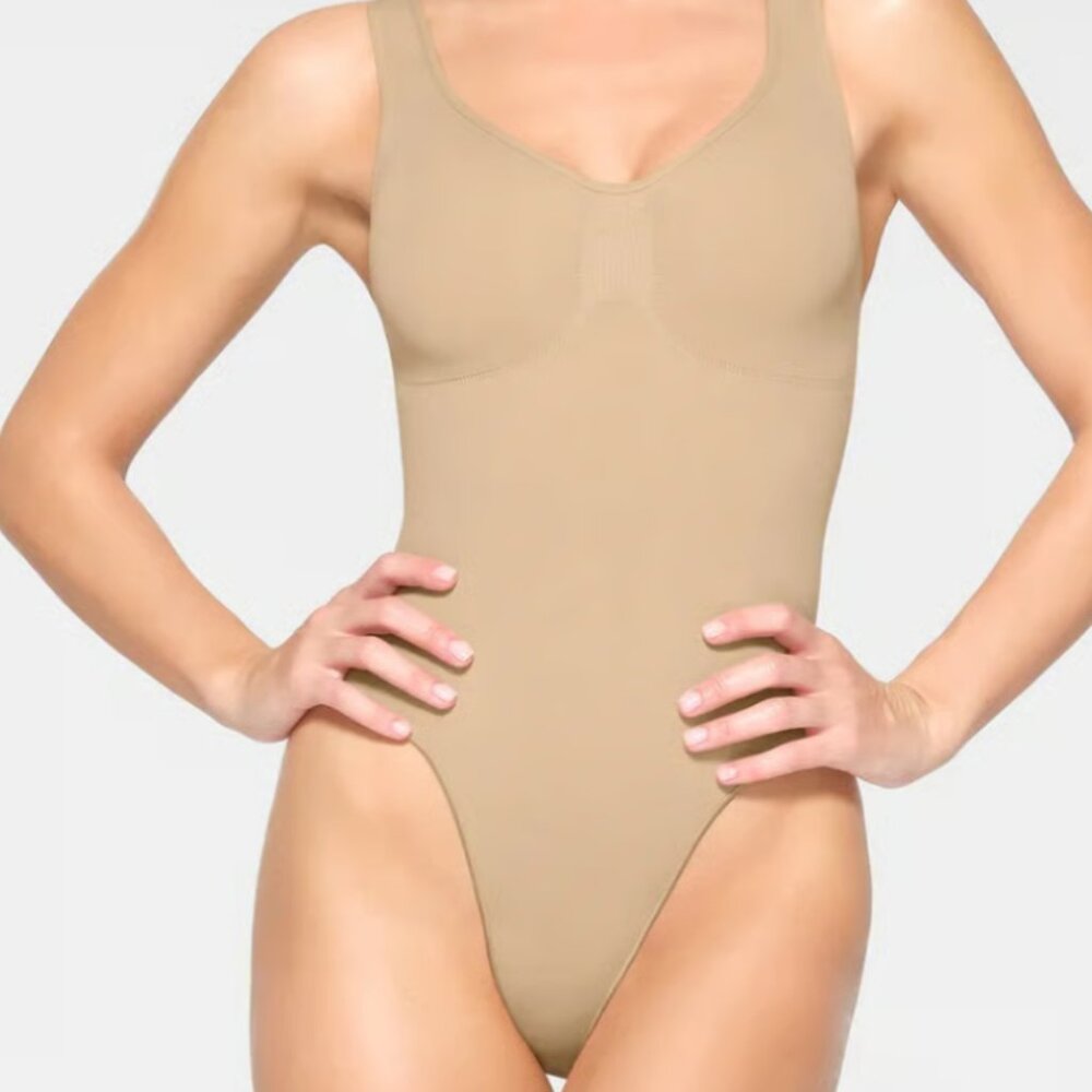 SKIMS Seamless Sculpt Thong Bodysuit in Cocoa